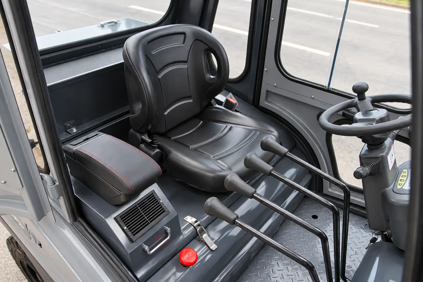 Enclosed forklift cab with seat, four hydraulic control levers and steering wheel