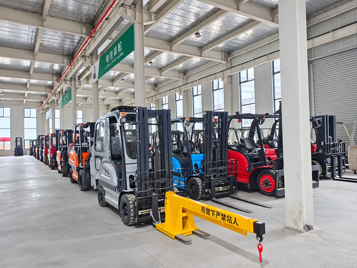 Electric forklifts arranged inside the LETENG assembly workshop